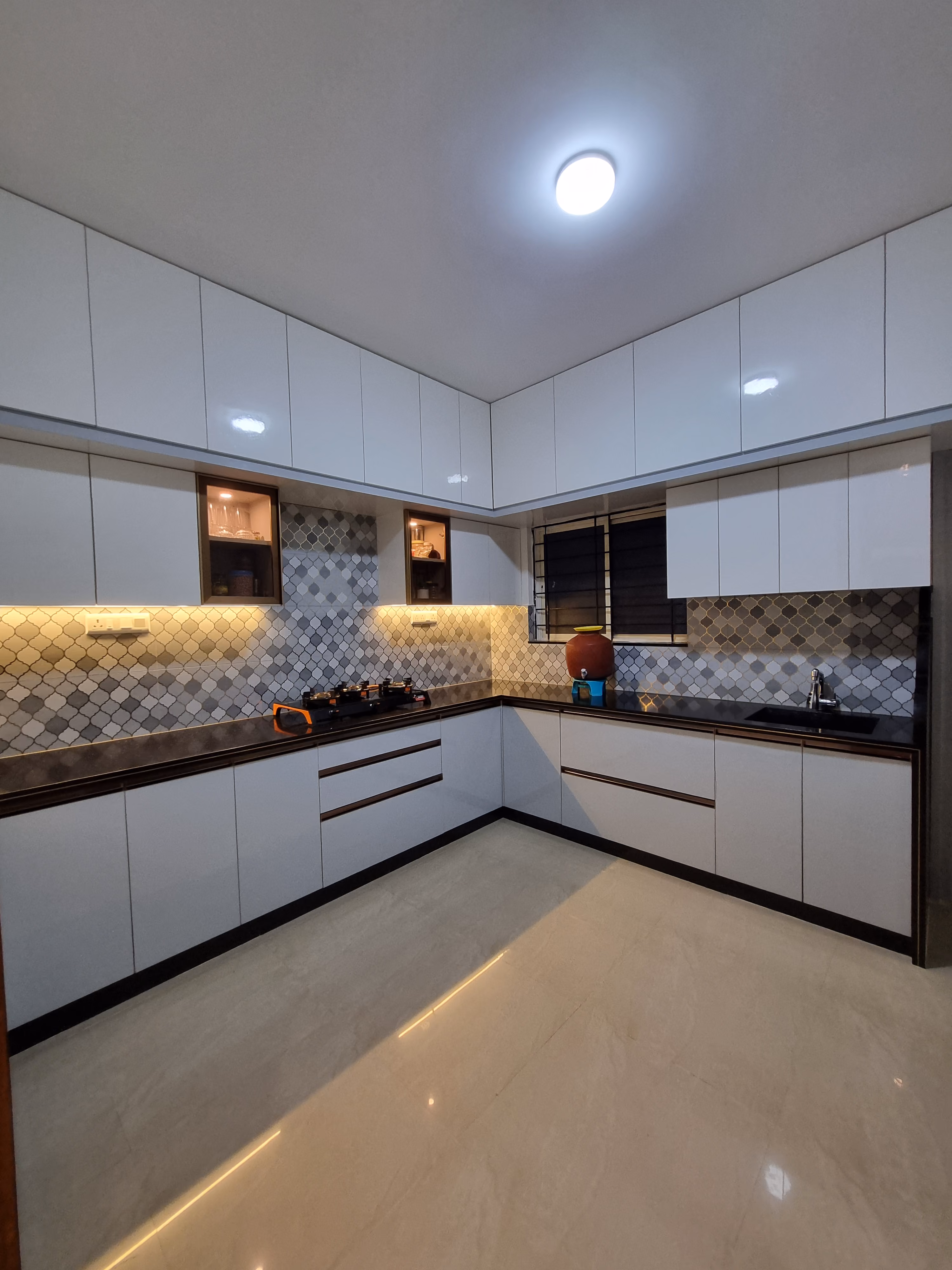 Factory-made modular kitchen with patterned backsplash
